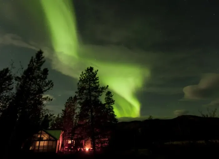 Framed Print : Illuminated, lit wall tent, cabin with swirling northern polar lights, Aurora Borealis, green, near Whitehorse, Yukon Territory, Canada