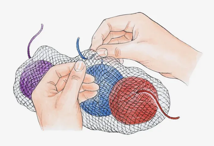 Framed Print : Illustration of securing balls of wool in net back using safety pin to prevent tangling Framed Print : Illustration of securing balls of wool in net back using safety pin to prevent tangling