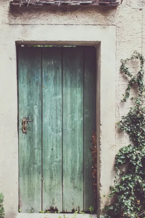 Framed Print : Image of a damaged, old and deteriorating brick wall with half of an old, wooden door on a run down house Framed Print : Image of a damaged, old and deteriorating brick wall with half of an old, wooden door on a run down house