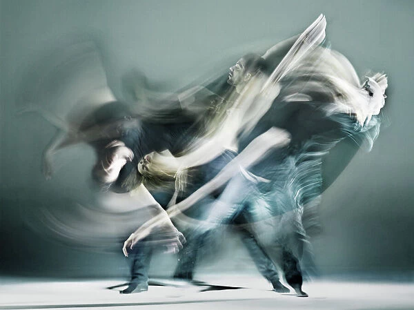 Duet. The image shows a continuous flow a two dancers in a fierce duet
