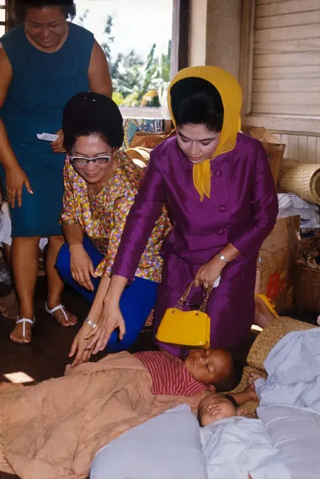 Framed Print : Imelda Marcos Greeting Ill Child with Family Nearby Framed Print : Imelda Marcos Greeting Ill Child with Family Nearby