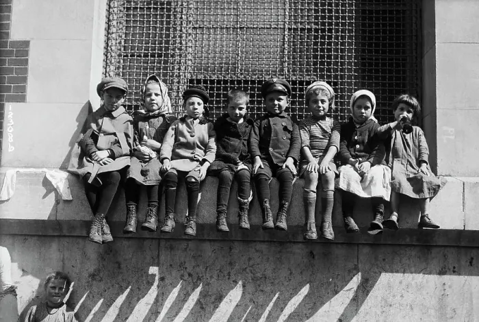 Framed Print : Immigrant Children Sitting on Window Ledge Framed Print : Immigrant Children Sitting on Window Ledge