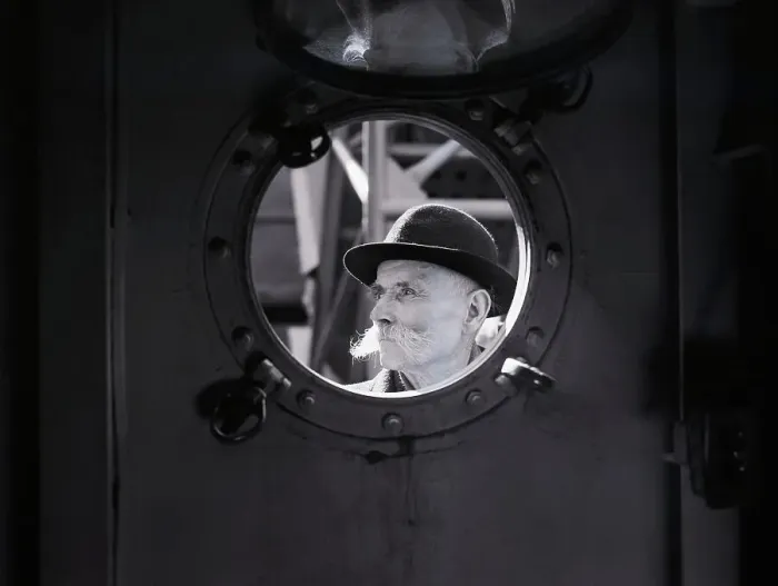 Framed Print : Immigrant Man Staring Through Porthole Framed Print : Immigrant Man Staring Through Porthole