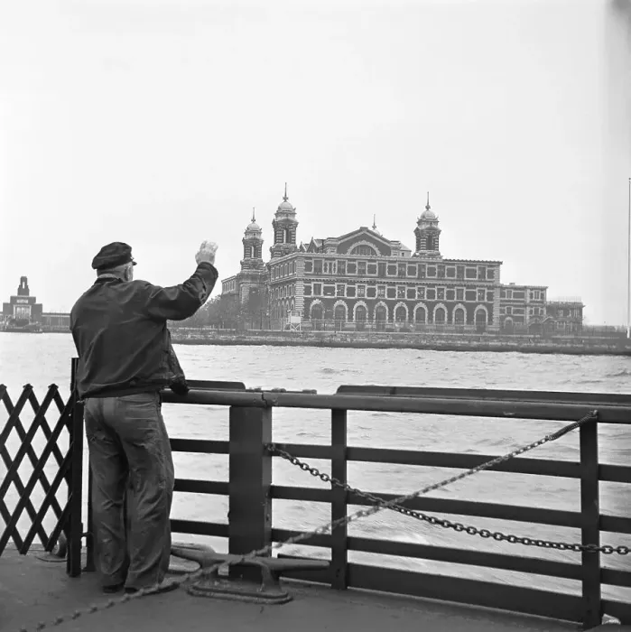 Framed Print : Immigration Employee Waves Goodbye at Closing of Ellis Island Framed Print : Immigration Employee Waves Goodbye at Closing of Ellis Island