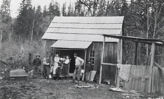 Framed Print : Indian Logger Stands In Front Of Home Framed Print : Indian Logger Stands In Front Of Home