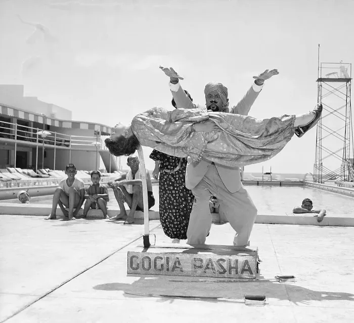Framed Print : Indian Magician Suspends Woman on Sword