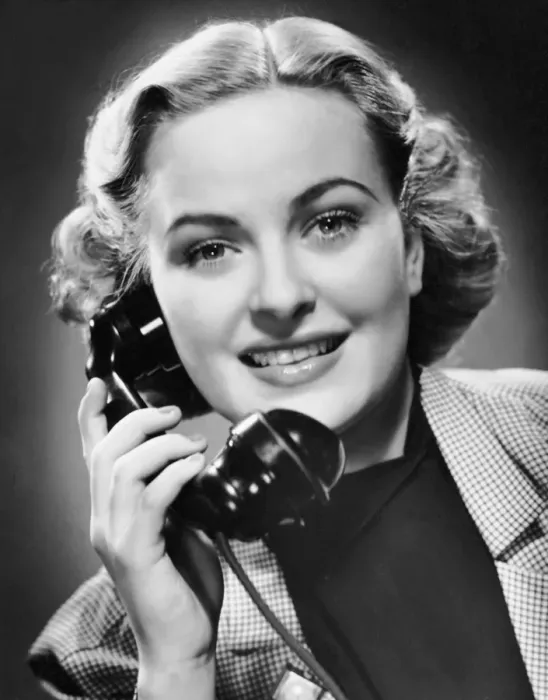 Framed Print : Indoor portrait of woman on telephone Framed Print : Indoor portrait of woman on telephone