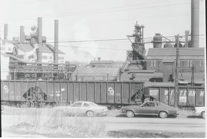Framed Print : Industrial Site with Passing Train and Automobiles Framed Print : Industrial Site with Passing Train and Automobiles