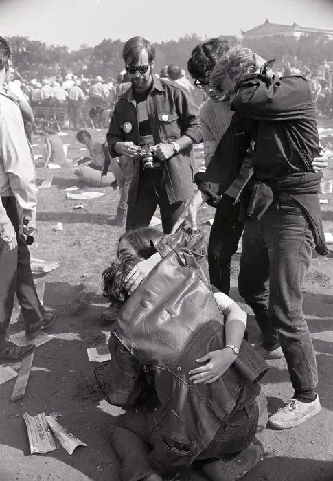 Framed Print : Injured Demonstrator Helped By Girl Framed Print : Injured Demonstrator Helped By Girl