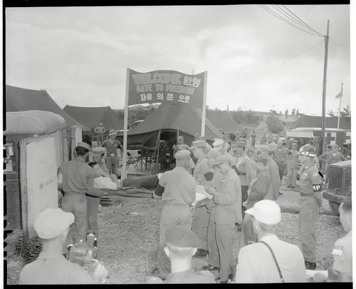 Framed Print : Injured Soldier Being Taken into Outdoor Medical Unit Framed Print : Injured Soldier Being Taken into Outdoor Medical Unit