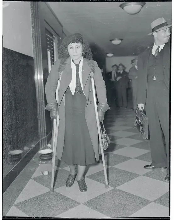 Framed Print : Injured Woman on Crutches