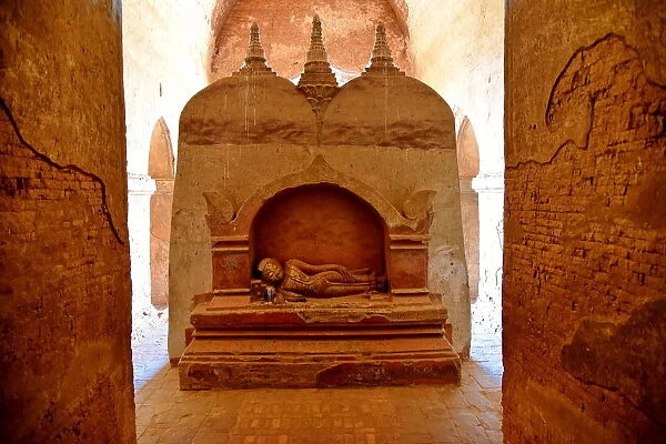 Inside Dhamma Yan Gyi with stone buddha sculpture Temple, Bagan, unesco ruins Myanmar. Asia