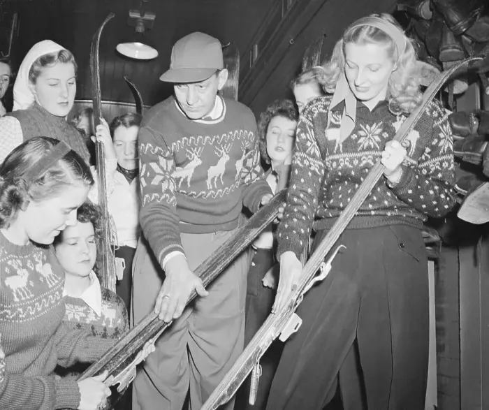 Framed Print : Instructor Teaching Girls About Waxing Skis Framed Print : Instructor Teaching Girls About Waxing Skis