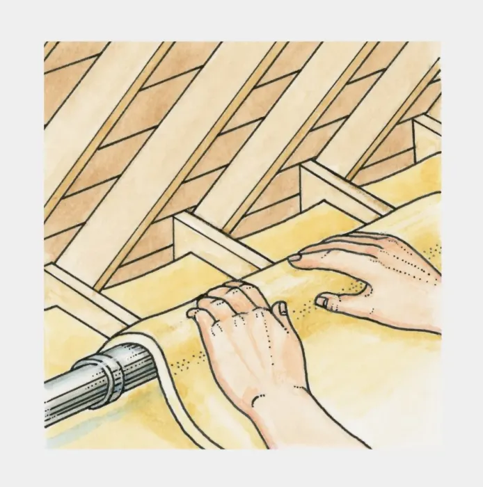 Framed Print : Insulation material being wrapped around pipes in the loft of a house Framed Print : Insulation material being wrapped around pipes in the loft of a house