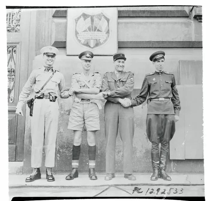 Framed Print : International Soldiers Conducting Four Way Handshake