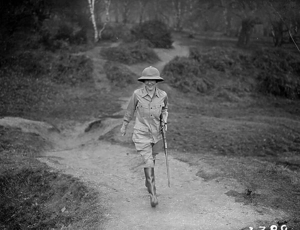 Intrepid. December 1926: Woman explorer Mrs Glover in her working gear and well armed