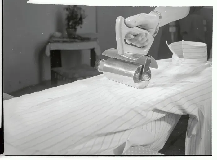 Framed Print : Inventor Demonstrating Use of a Electric Roller Iron Framed Print : Inventor Demonstrating Use of a Electric Roller Iron