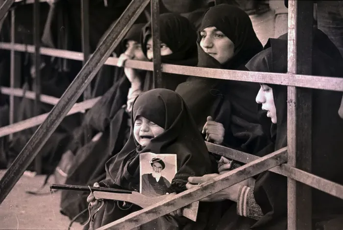 Framed Print : Iranian Girl in Tears with Pop Gun