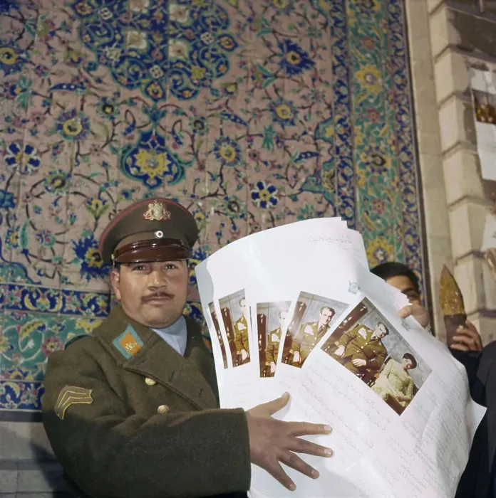 Framed Print : Iranian Officer Displaying Documents Framed Print : Iranian Officer Displaying Documents