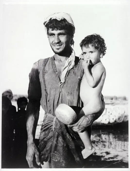 Framed Print : Iraqi Father Holding His Young Son Framed Print : Iraqi Father Holding His Young Son