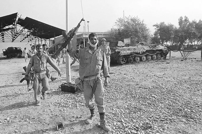 Framed Print : Iraqi Soldier Raises AK47 Rifle