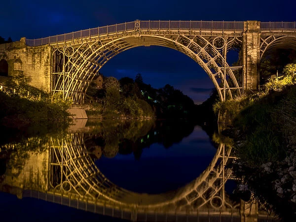 Iron bridge illuminated at dusk
