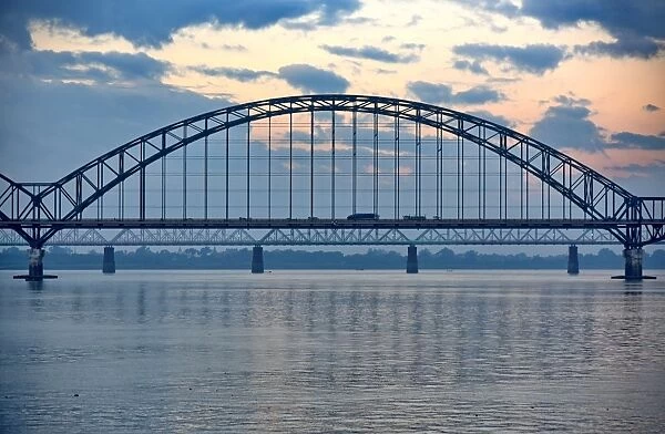 Irrawaddy bridge at sunset with reflection sky Myanmar Asia