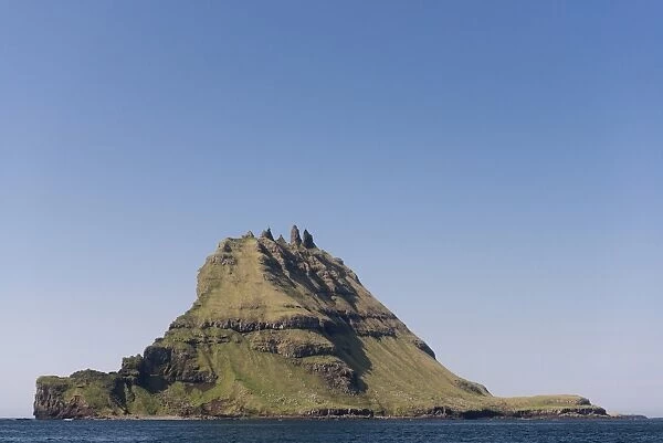 Islet of Tindholmur or Tindholmur, rugged cliffs rising from the sea, Vagar, Faroe Islands, Denmark