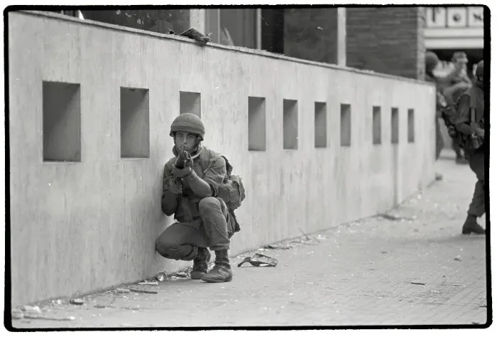 Framed Print : Israeli Soldier Crouches While On Patrol in Beirut Framed Print : Israeli Soldier Crouches While On Patrol in Beirut