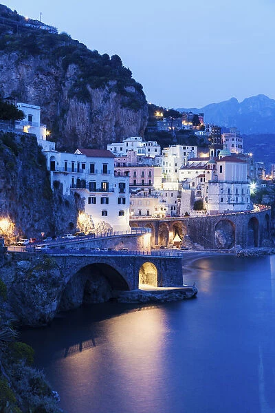 Italy, Campania, Atrani, Town on coastline at dusk