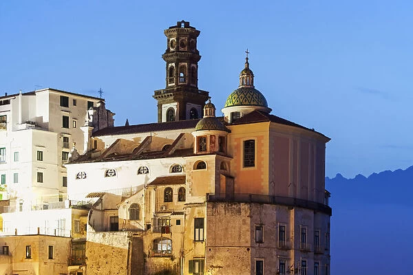 Italy, Campania, Atrani, Townhouses and tower at dusk