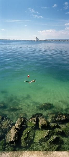 Italy, Sicily, Syracuse, snorkeling in Mediterranean Sea
