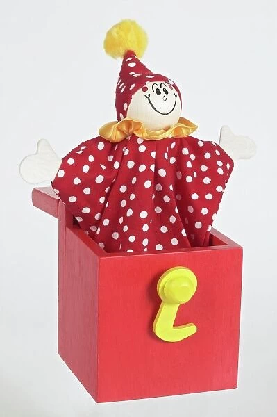 program stemning udslæt Jack in a box, smiling clown puppet popping out of red