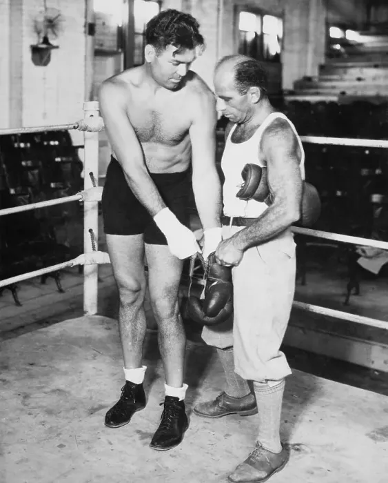 Framed Print : Jack Dempsey Putting on Boxing Gloves Framed Print : Jack Dempsey Putting on Boxing Gloves