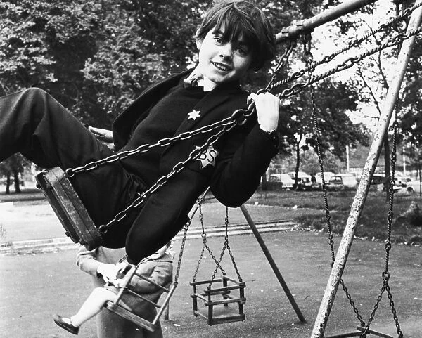 Jack Wild. English child actor Jack Wild (1952 - 2006) on a swing in his