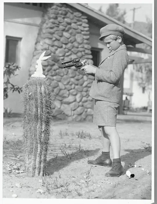 Framed Print : Jackie Cooper Aiming a Gun Framed Print : Jackie Cooper Aiming a Gun