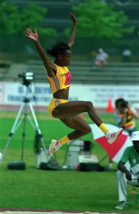 Framed Print : Jackie Joyner-Kersee Sailing Through the Air Framed Print : Jackie Joyner-Kersee Sailing Through the Air