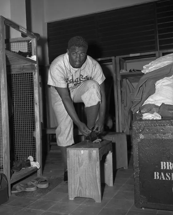 Framed Print : Jackie Robinson Putting on Uniform