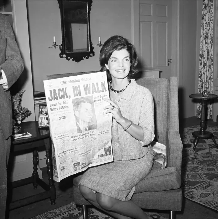 Framed Print : Jacqueline Kennedy Holding Newspaper