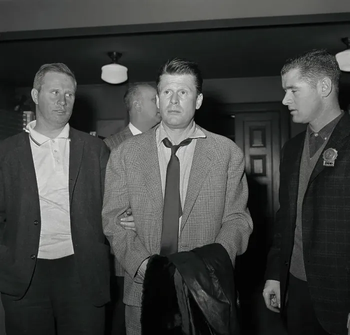 : Jacques Angelvin Being Escorted by Police Detective : Jacques Angelvin Being Escorted by Police Detective