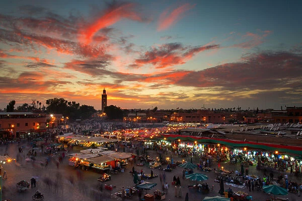 Jamaa el Fna (also Jemaa el-Fnaa, Djema el-Fna or Djemaa el-Fnaa) is a square and market place in Marrakeshs medina quarter (old city) with Koutubia in background. Marrakesh, Morocco, north Africa