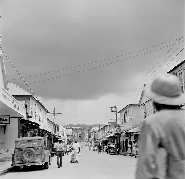Framed Print : Jamaica. JAMAICA - FEBRUARY 1946: A view down a busy local street in Jamaica. Framed Print : Jamaica. JAMAICA - FEBRUARY 1946: A view down a busy local street in Jamaica.