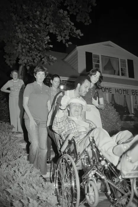 Framed Print : James Brady Being Wheeled in Chair