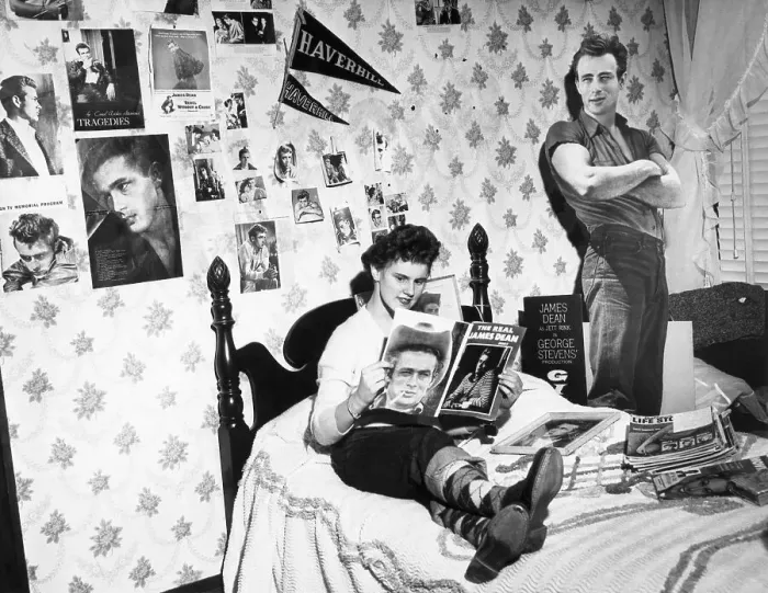 Framed Print : James Dean Fan Reading Magazines on Bed
