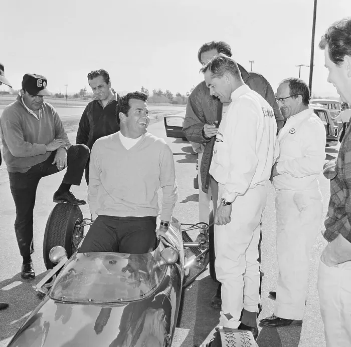 Framed Print : James Garner Slipping into a Race Car Framed Print : James Garner Slipping into a Race Car