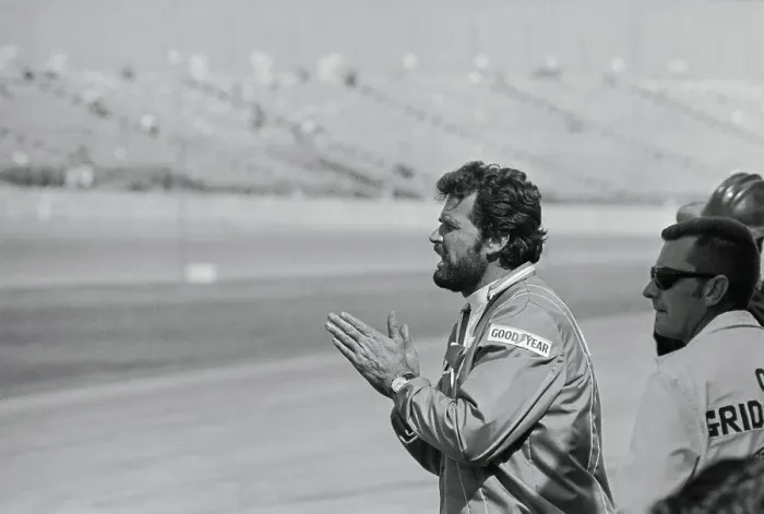 Framed Print : James Garner Watching an Auto Race Framed Print : James Garner Watching an Auto Race
