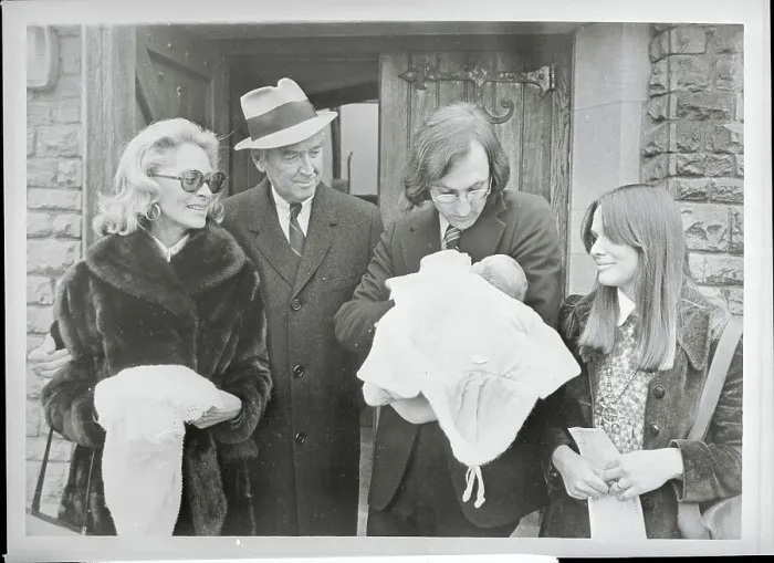 Framed Print : James and Gloria Stewart Looking at Their Grandson Framed Print : James and Gloria Stewart Looking at Their Grandson
