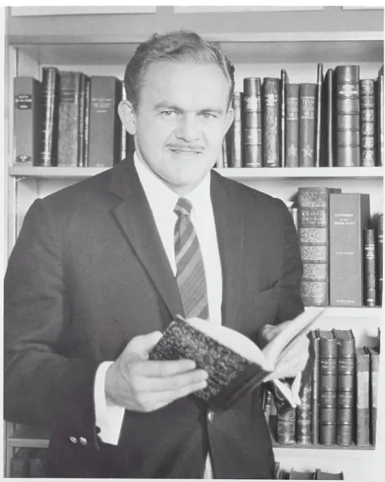 Framed Print : James Jones Holding Book Framed Print : James Jones Holding Book