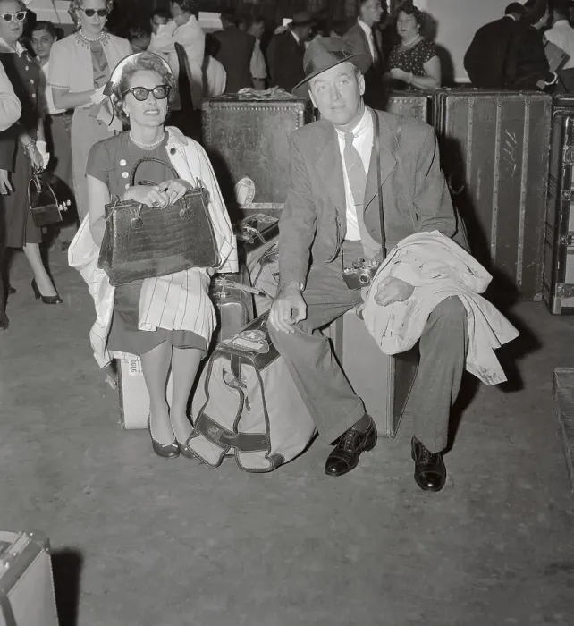 Framed Print : James Stewart and Wife Sitting on Luggage Framed Print : James Stewart and Wife Sitting on Luggage