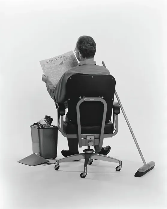 Framed Print : Janitor sitting, taking a break, reading the Wall Street Journal newspaper, rear view Framed Print : Janitor sitting, taking a break, reading the Wall Street Journal newspaper, rear view